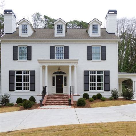 white houses with gray shutters